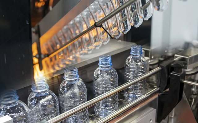 Bottles leaving a blow-moulding machine