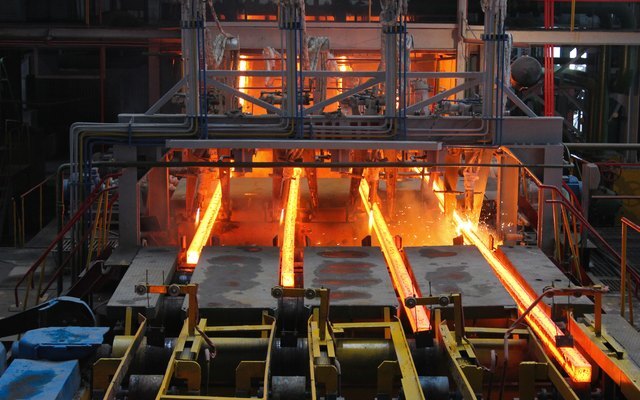 Glowing steel strands on a continuous caster