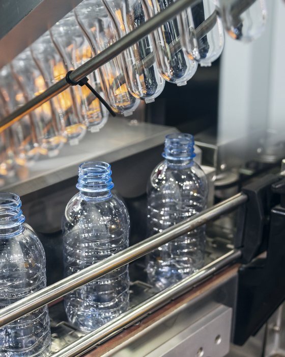 Bottles leaving a blow-moulding machine